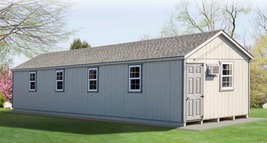 12x42 Commercial Kennel with light gray siding, white trim, and gray roofing.