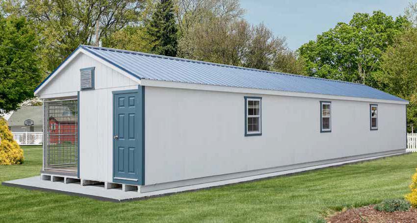 14x54 Commercial Kennel white siding, blue trim, and a blue door.
