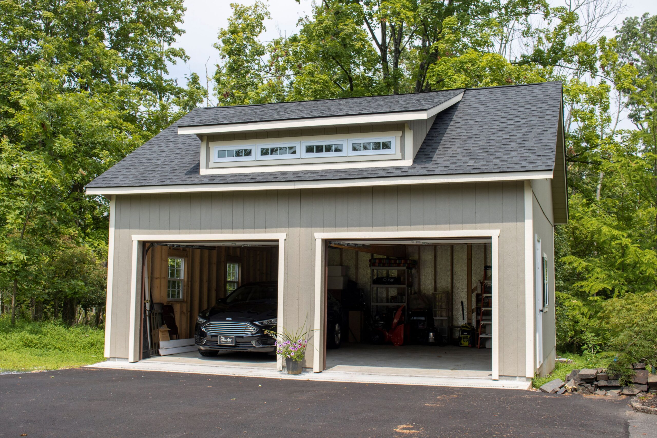 Exterior of a 2-story, 2-car Garden Shed Garage with gray siding.