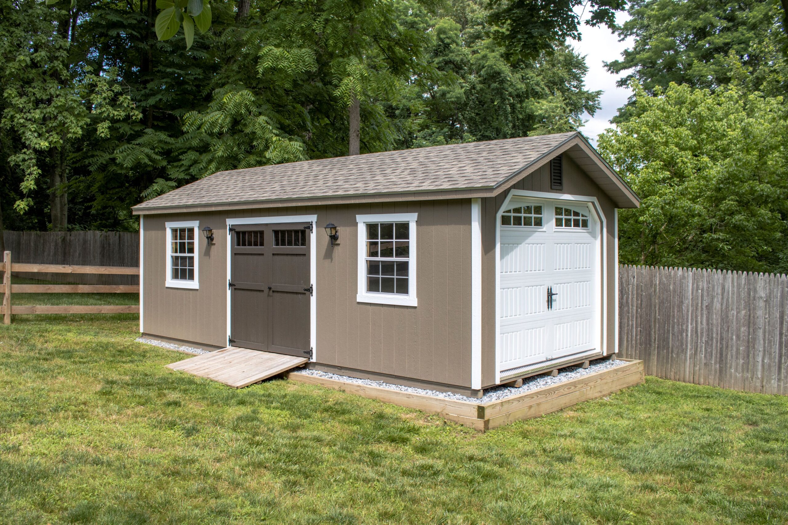 Exterior of a 1-car A-Frame Garage with brown siding and white trim.