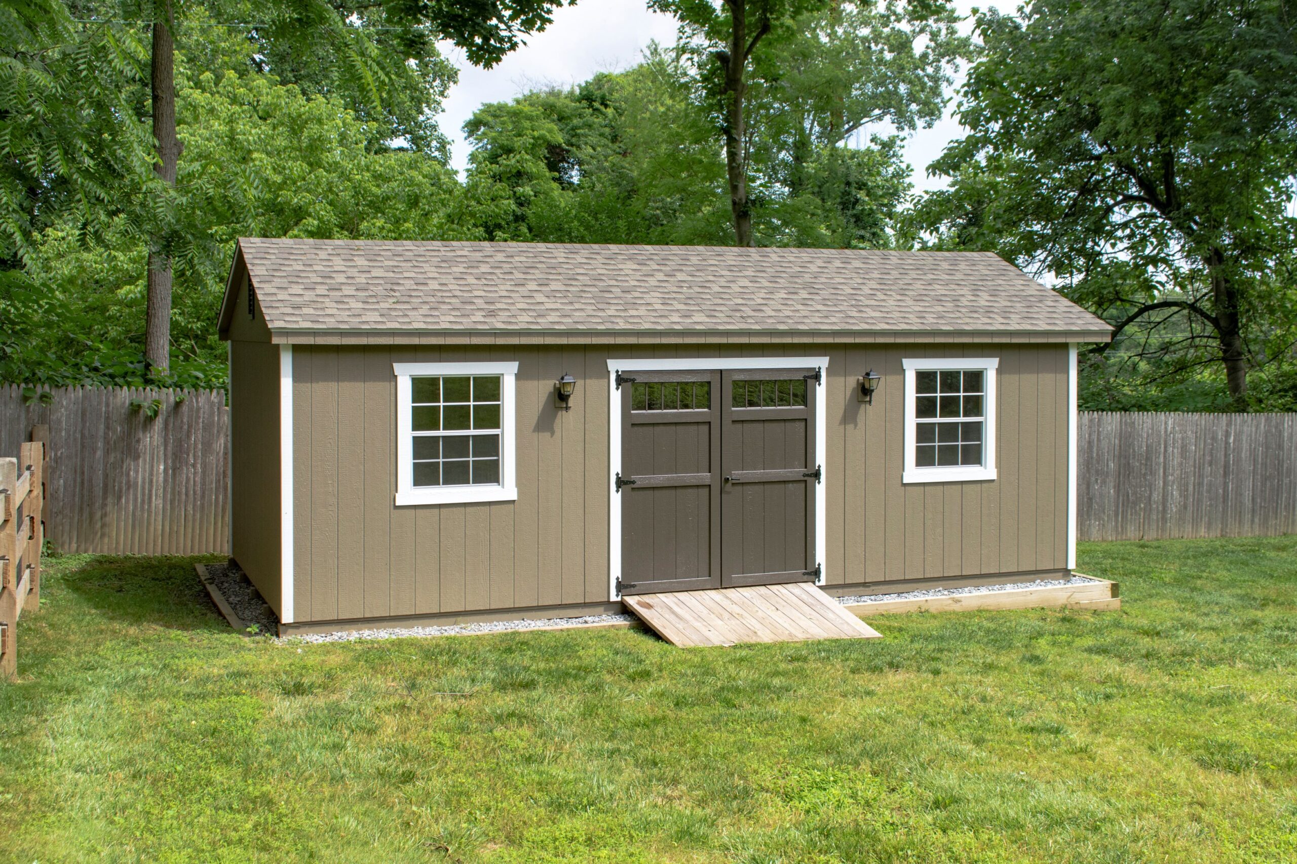 Exterior of a 1-car A-Frame Garage with brown siding and white trim.