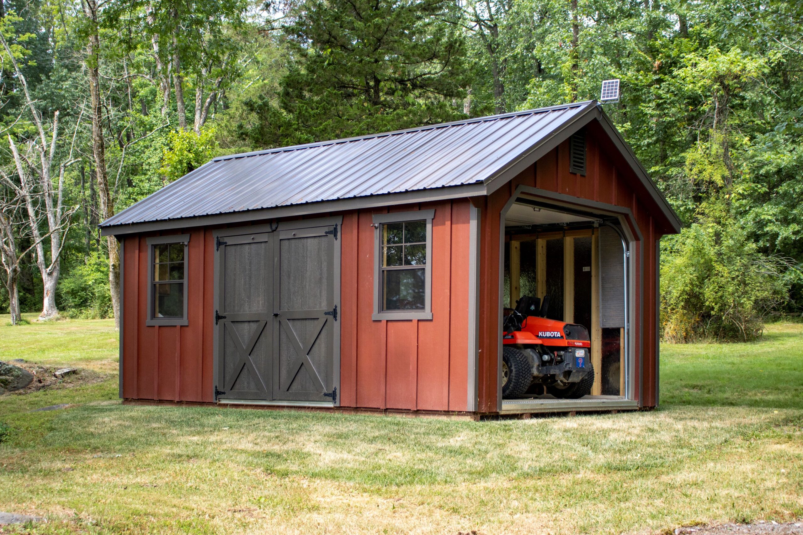 Exterior of a 1-story, 1-car Garden Shed Garage with red siding.