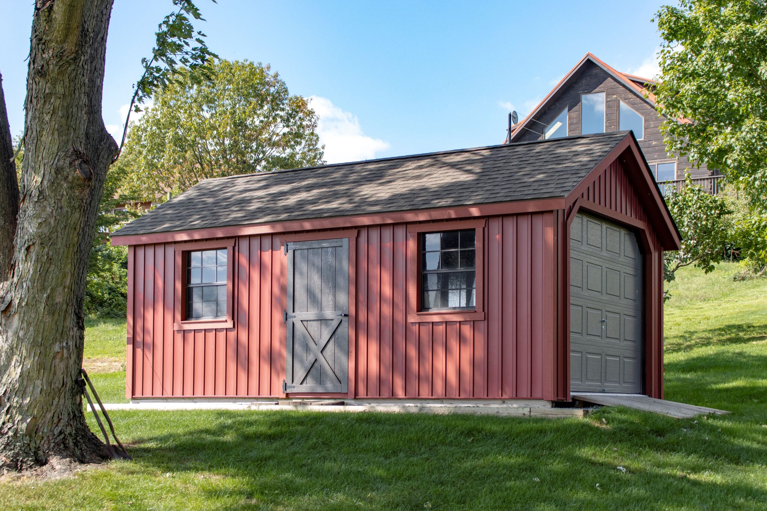 Exterior of a 1-story, 1-car Garden Shed Garage with red siding.