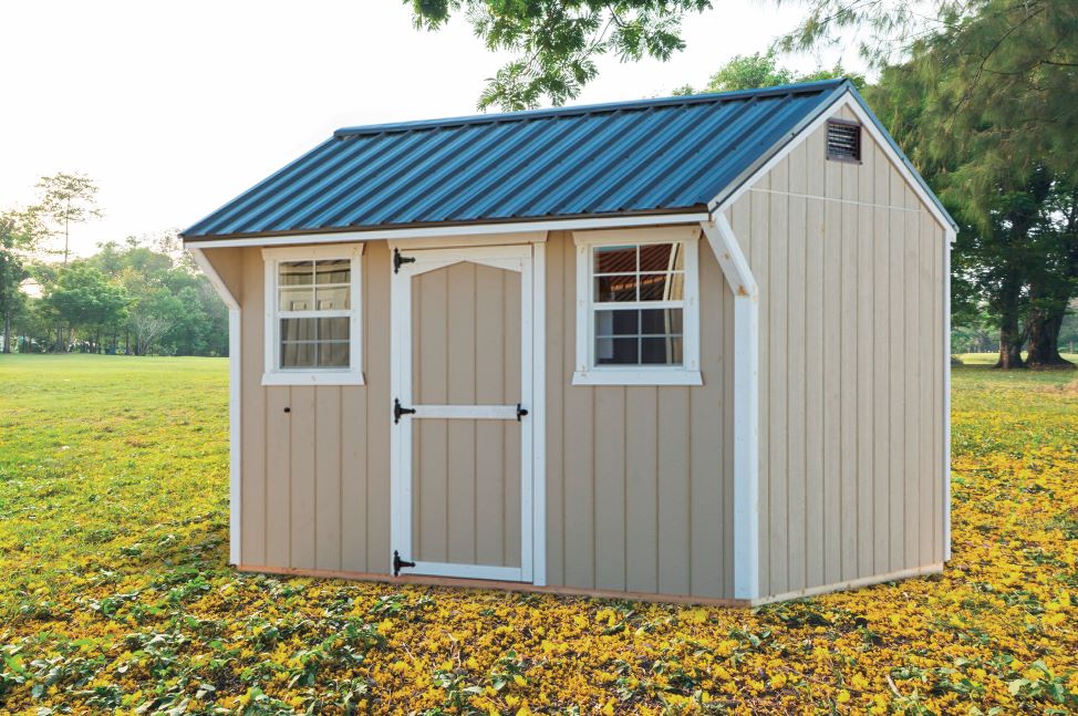 Exterior of a tan and white Quaker Shed