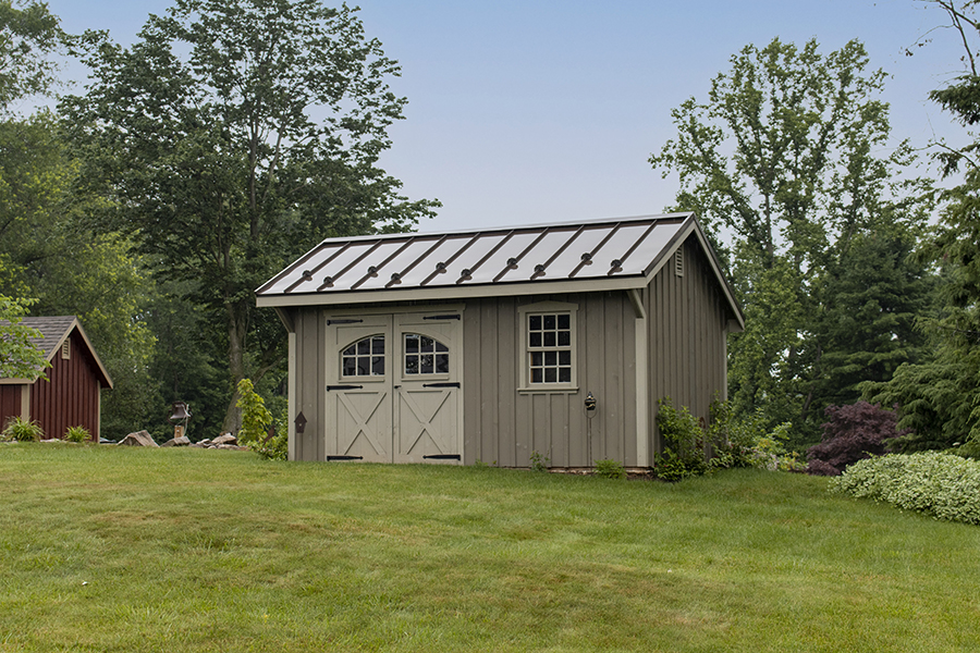 Front exterior of a gray Garden Quaker Shed