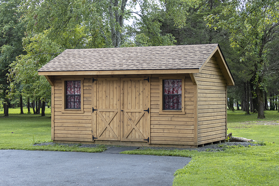 Front exterior of a natural wood Garden Quaker Shed