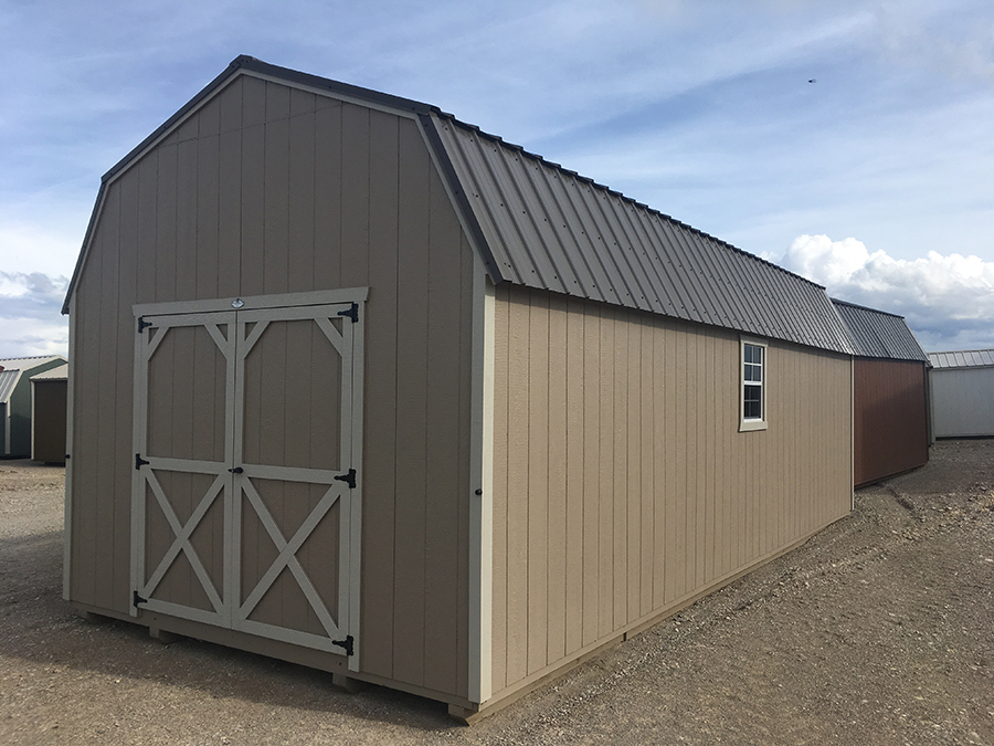 Front and side exterior of a High Barn Shed with brown siding and white trim.