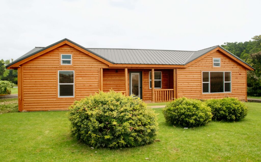 Front view of a Teton Log Cabin with a front porch