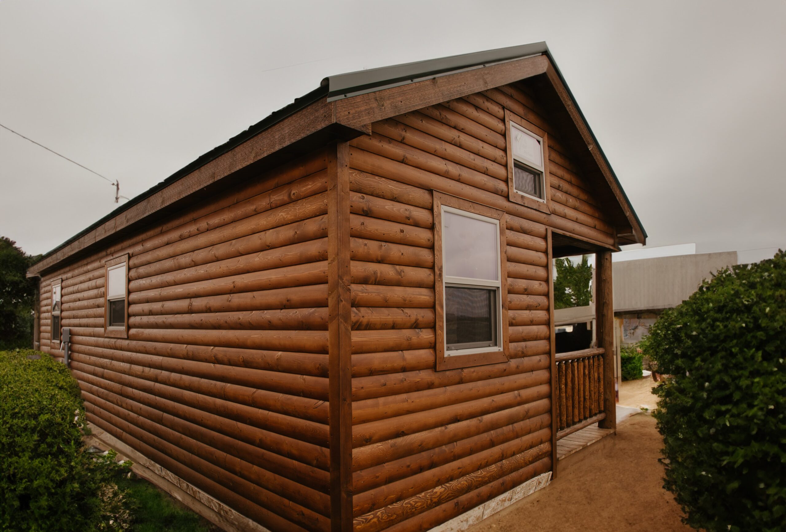 Back and side view of a Tiny House Log Cabin