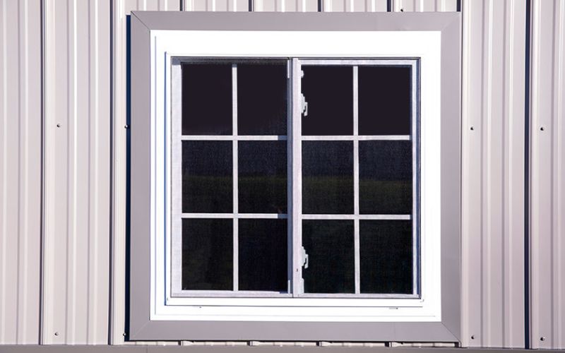 Close up of a white and gray 36x36 grid window with screen