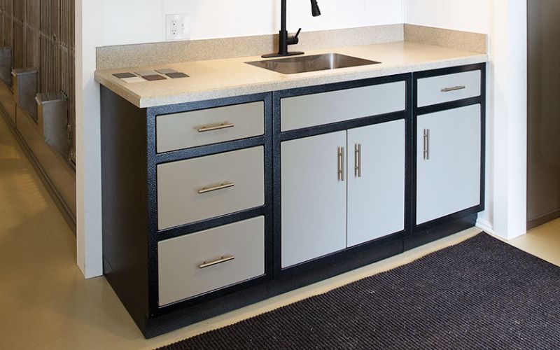Beige and black aluminum cabinets and sink