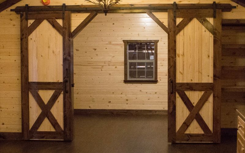 Cabin interior doorway with open double barn doors