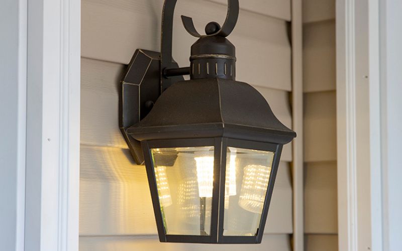 Close up of a black wall-mounted entrance light