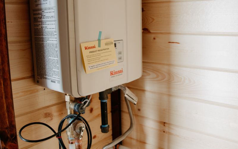 Close up of a propane tankless water heater in a cabin