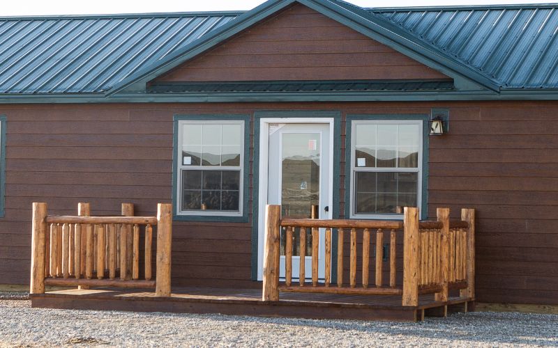 Close up of a cabin entrance with a side deck