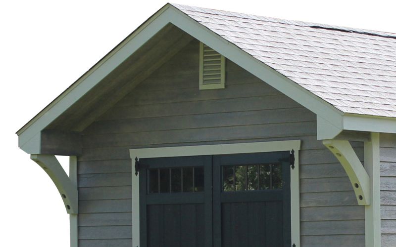 2 foot gable overhang on a shed with gray siding and white trim