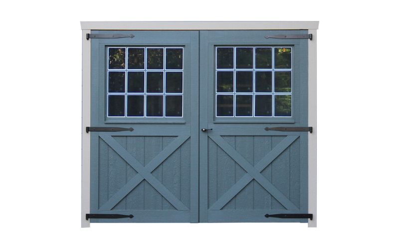 Carriage House style 8x7 wood double door with squared glass, black hinges, and blue paint