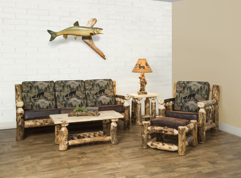 Aspen Collection Living Room pieces set up with a sofa, coffee table, end table, lamp, arm chair, and ottoman