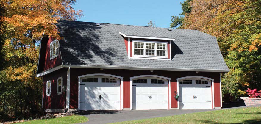Exterior of a 3-Car Gambrel Garage with red siding, white trim, white garage doors, and gray roofing
