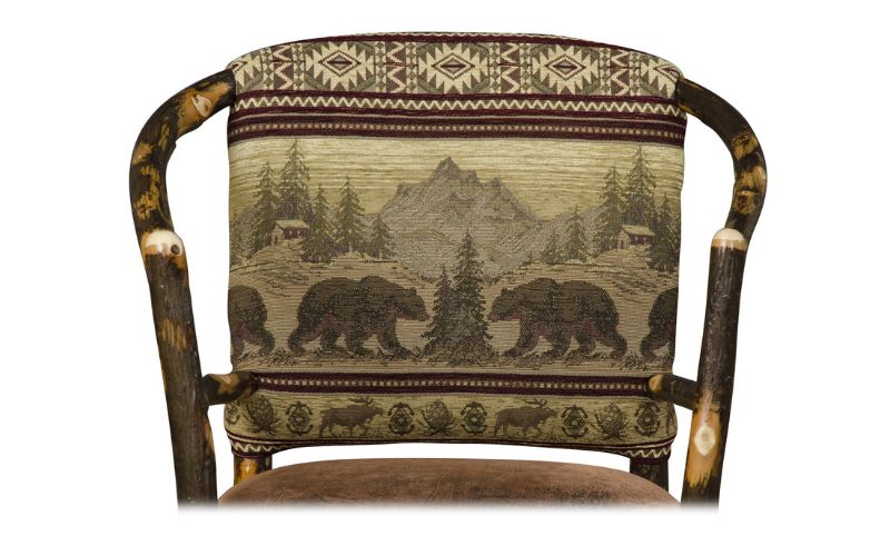 Green and brown fabric pattern with bears, mountains, trees, moose, and cabins