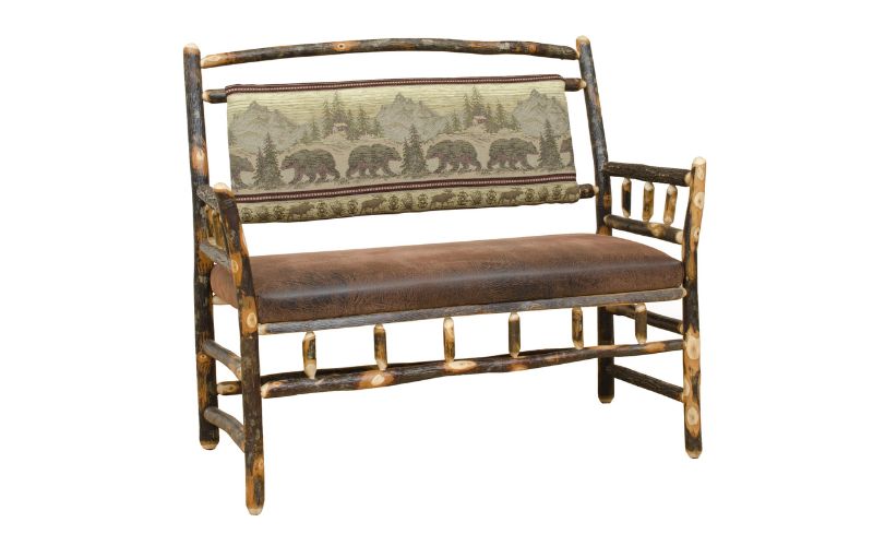Wood bench with a bear patterned back cushion and a brown leather seat cushion