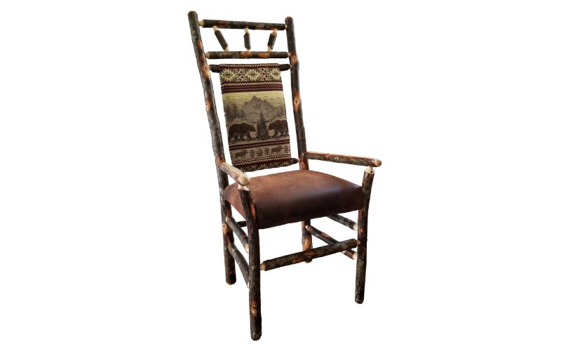High back dining arm chair with a bear patterned back cushion and a brown leather seat cushion