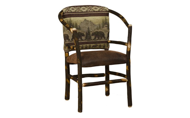Wood hoop chair with a bear patterned back cushion and brown leather seat cushion