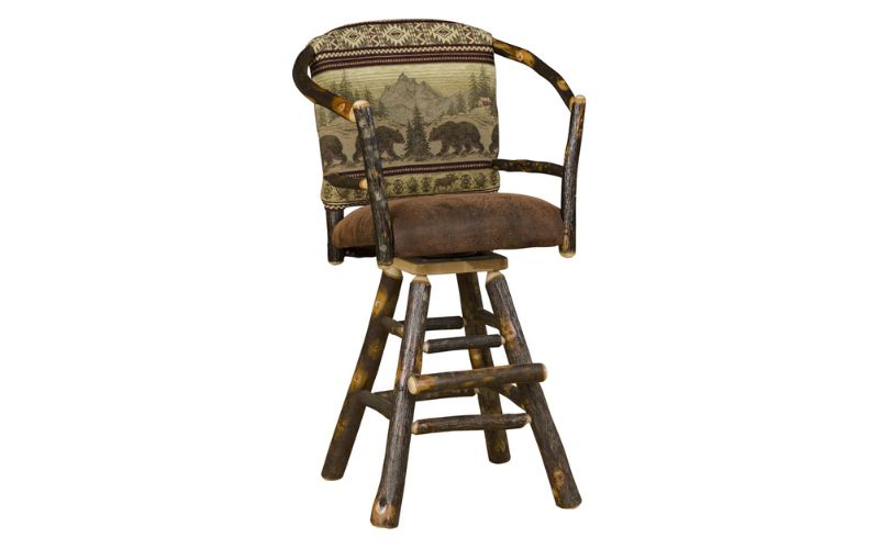 Swivel barstool chair with a hoop back, a bear patterned back cushion, and a brown leather seat cushion