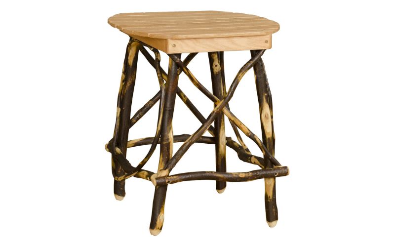 End table with a round top and dark branch base
