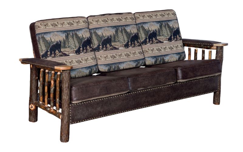 Wood base sofa with 3 bear patterned back cushions, 3 brown leather seat cushions, brown leather arm rest padding, and brown leather accents
