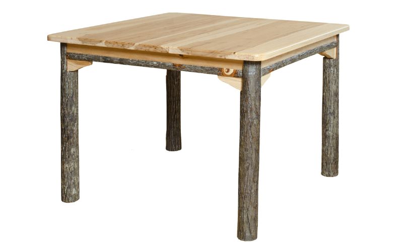 Solid top square dining table with a light-colored wood top and branch legs