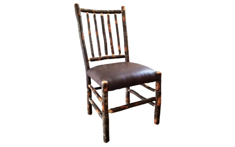 Dining side chair with a stick back and a brown leather padded seat
