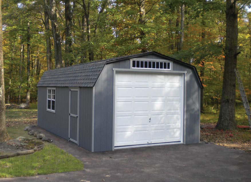 High Barn Garage with dark gray siding, dark gray roofing, light gray trim, and a white garage door