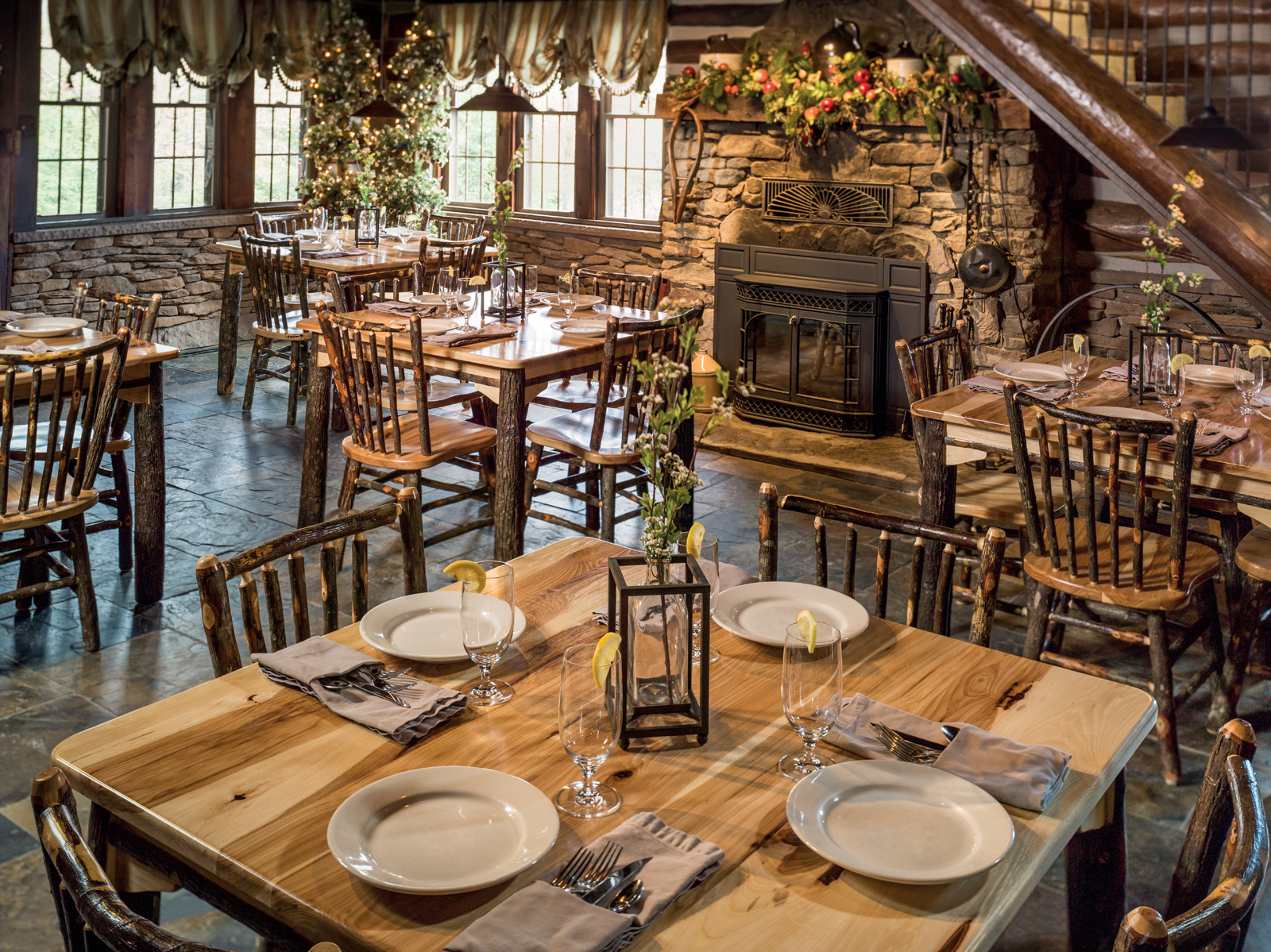 Hickory Collection Restaurant Setting with 5 tables and side chairs around a fireplace