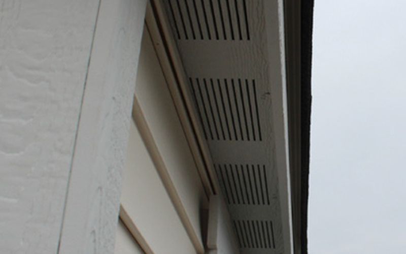 Close up of soffit vents on a tan building