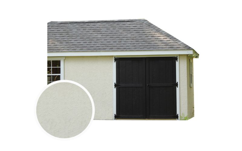 White stucco siding on a shed with a gray roof, white trim, and dark brown doors