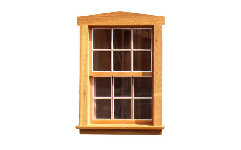 Vertical Wood Sliding Window with a screen and natural wood trim