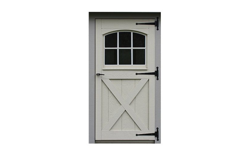 Carriage house wood single door painted white with arched 6-panel windows and black hinges