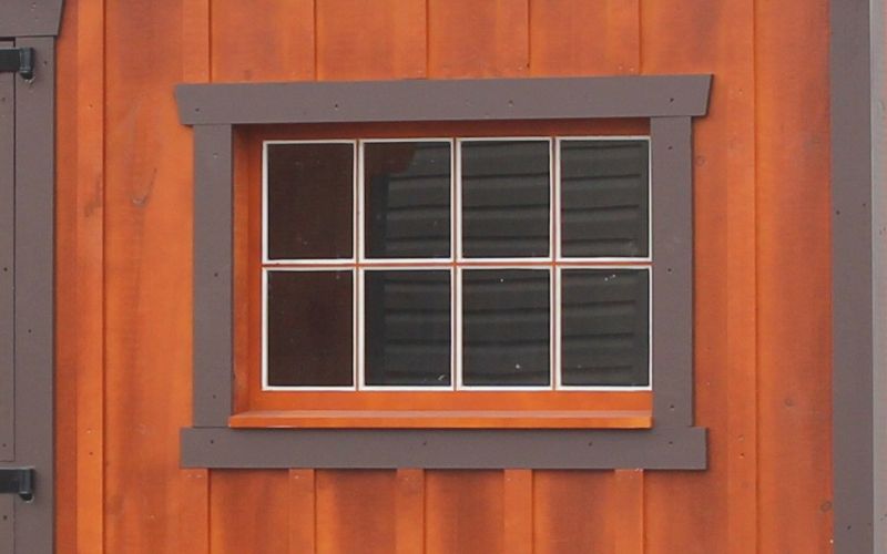 8-pane wood window with brown wood trim
