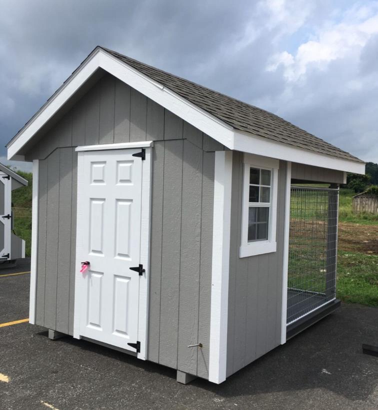 Eight by ten residential elite dog kennel with gray wood siding, white trim, a white single door, a white window, one dog box, and 1 dog run.