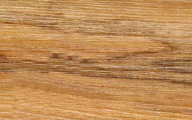 Close up of Amber Vinyl Plank flooring.