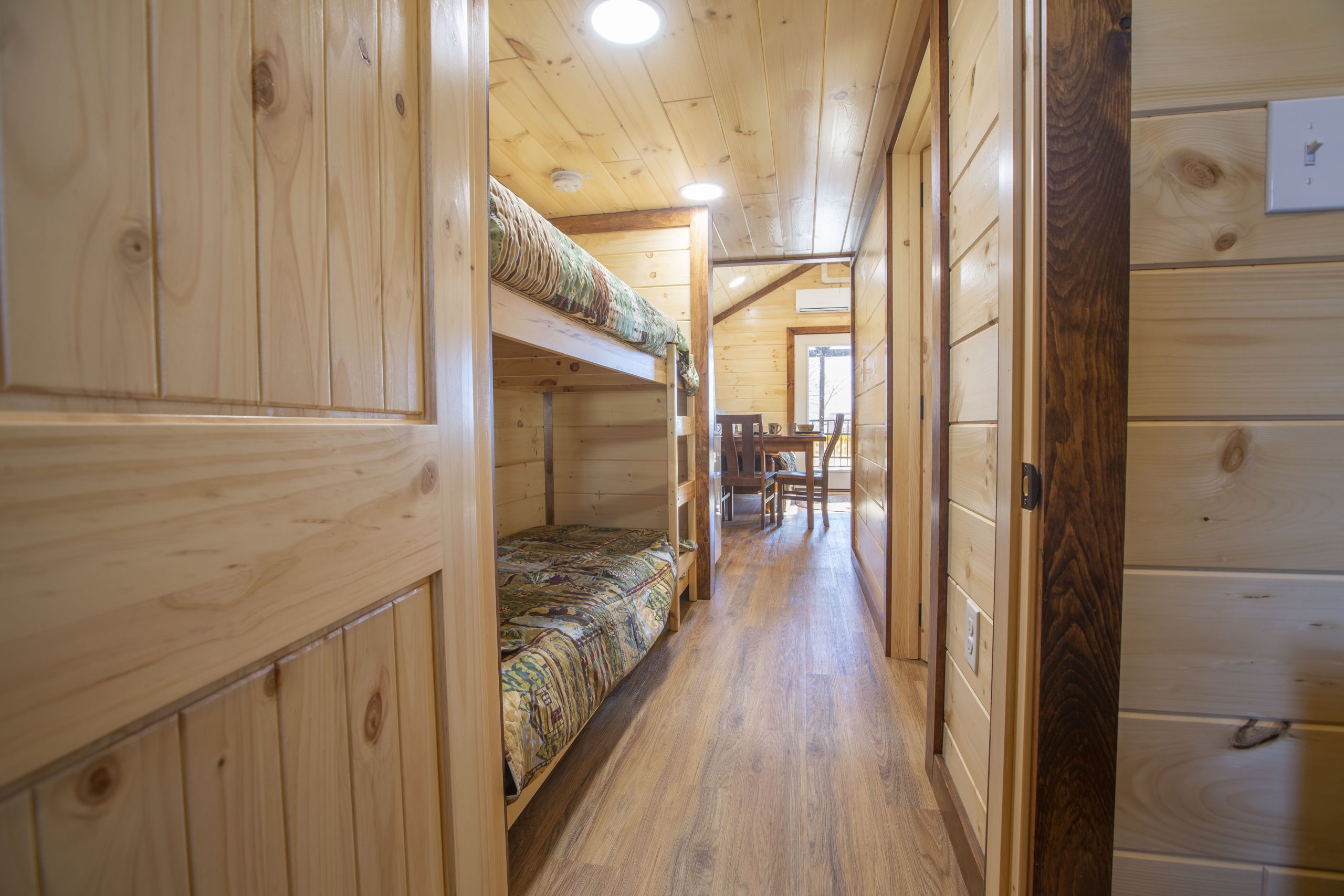 View of a hallway in an Appalachian Park Model with built-in bunk beds.