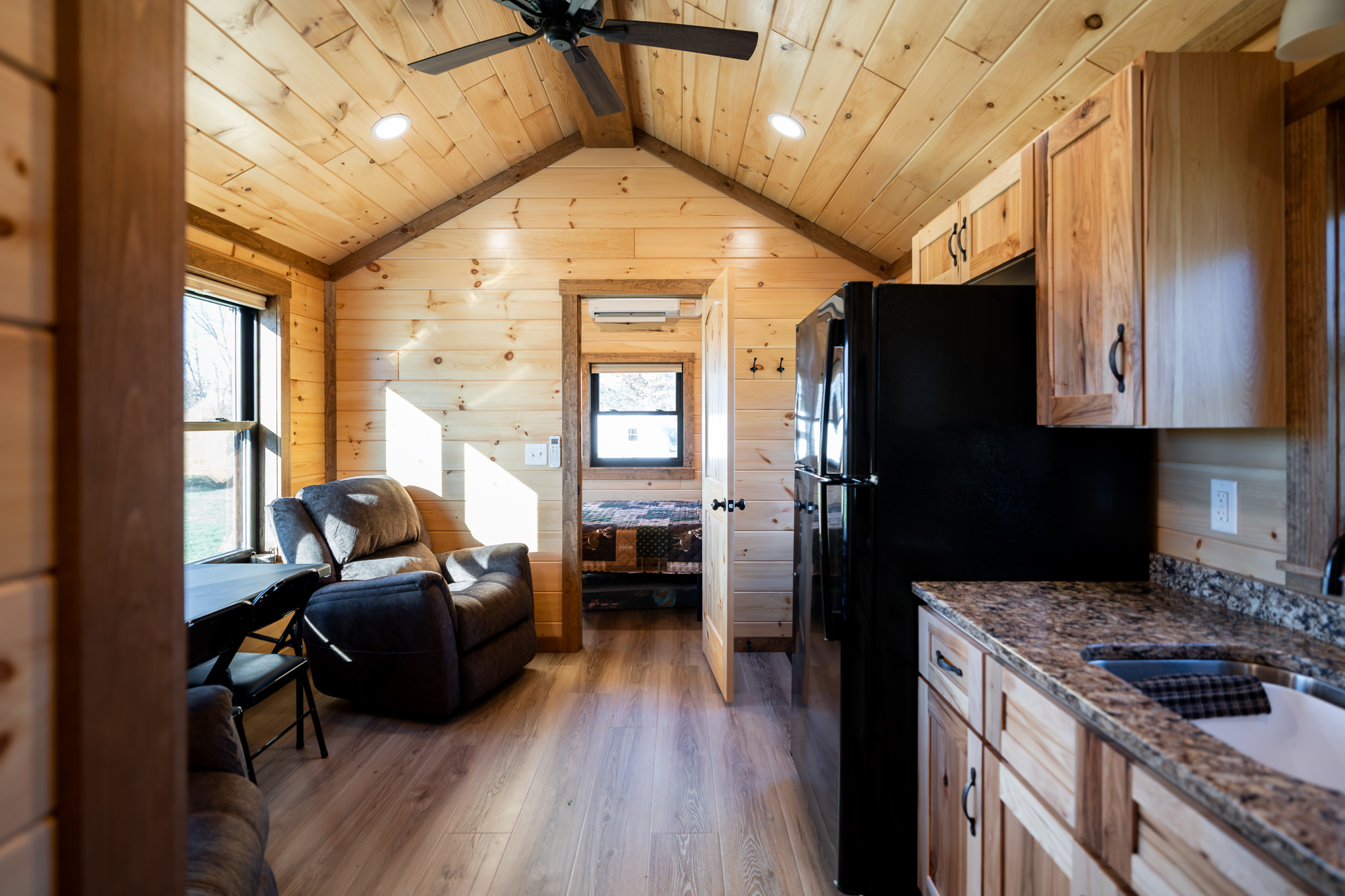 kitchen, living, and dining space in park model