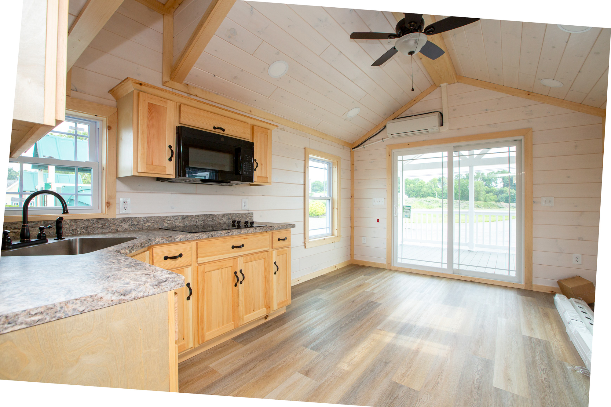 empty kitchen and living space in summit view park model