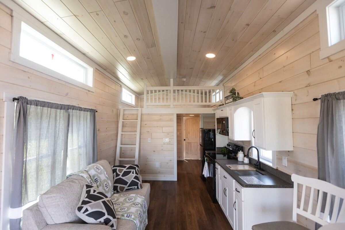 interior of summit view park model with living room, kitchen, and loft
